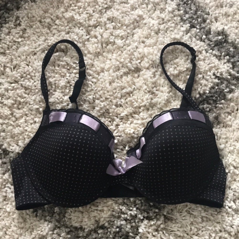Black bra with purple polka dots and detailing.